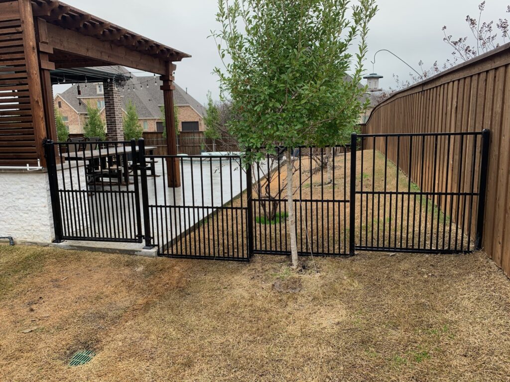 Wrought Iron Fence with Puppy Panels